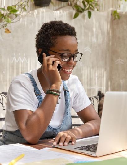successful-smiling-freelancer-recieves-consultancy-via-cell-phone